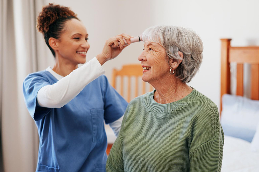 A carer providing domiciliary care to an older client at home